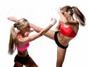 5819_girls-fighting-two-attractive-athletic-over-white-background-32236979.