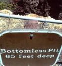 68341_bottomless-pit-65-feet-deep-funny-sign.