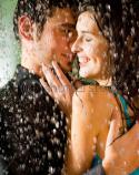 8387stock-photo-young-happy-couple-kissing-and-hugging-under-a-rain-6021649.